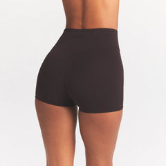 NikeSKIMS STUDIO STRETCH 3" SHORT | DARK ROAST ON A MODEL SIDE VIEW @ | FOCUS: 0.0, 1.0, 0.9