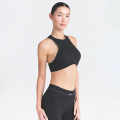 NikeSKIMS RIBBED SEAMLESS RACER FRONT BRA | OBSIDIAN ON A MODEL SIDE VIEW