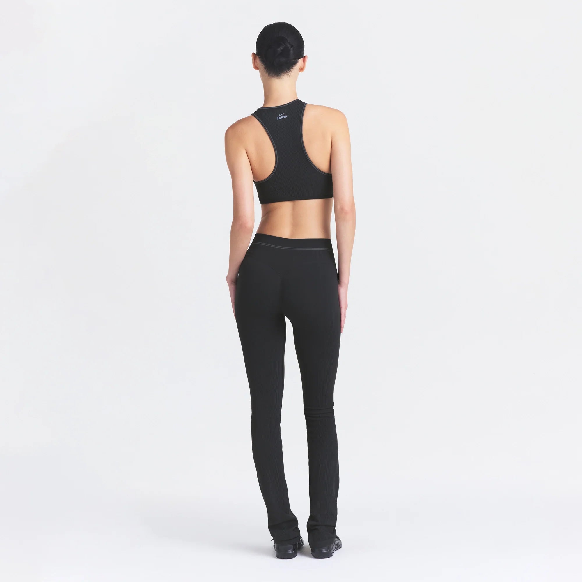 NikeSKIMS RIBBED SEAMLESS RACER FRONT BRA | OBSIDIAN ON A MODEL FRONT VIEW