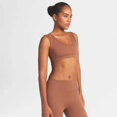 NikeSKIMS MATTE DOUBLE STRAP SCOOP BRA | CAROB BROWN ON A MODEL SIDE VIEW @ | FOCUS: 0.0, 1.0, 0.9