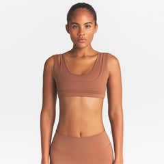 NikeSKIMS MATTE DOUBLE STRAP SCOOP BRA | CAROB BROWN ON A MODEL SIDE VIEW @ | FOCUS: 0.0, 1.0, 0.9