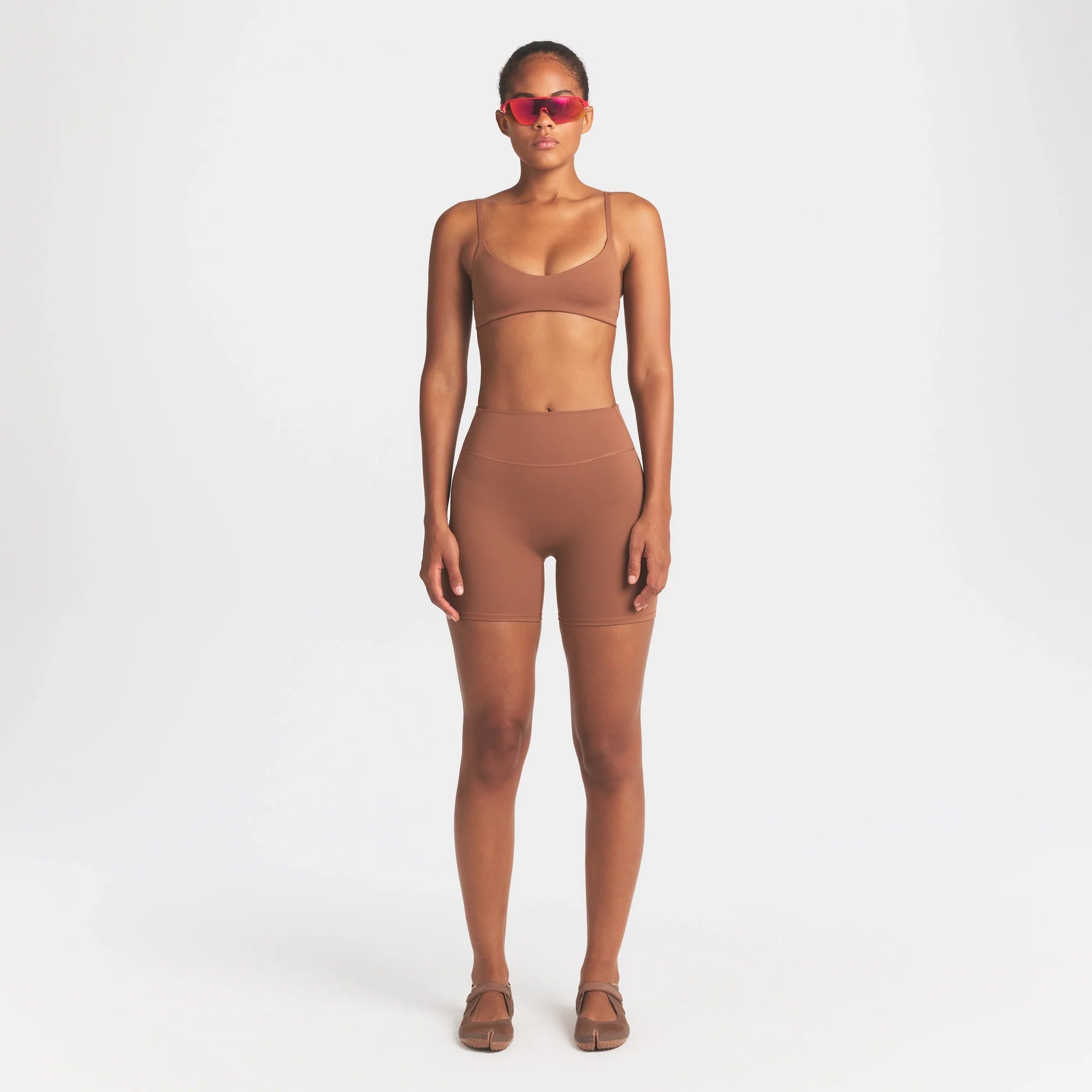 NikeSKIMS MATTE MICRO SCOOP BRA | CAROB BROWN ON A MODEL FRONT VIEW @ | FOCUS: 0.0, 1.0, 0.9
