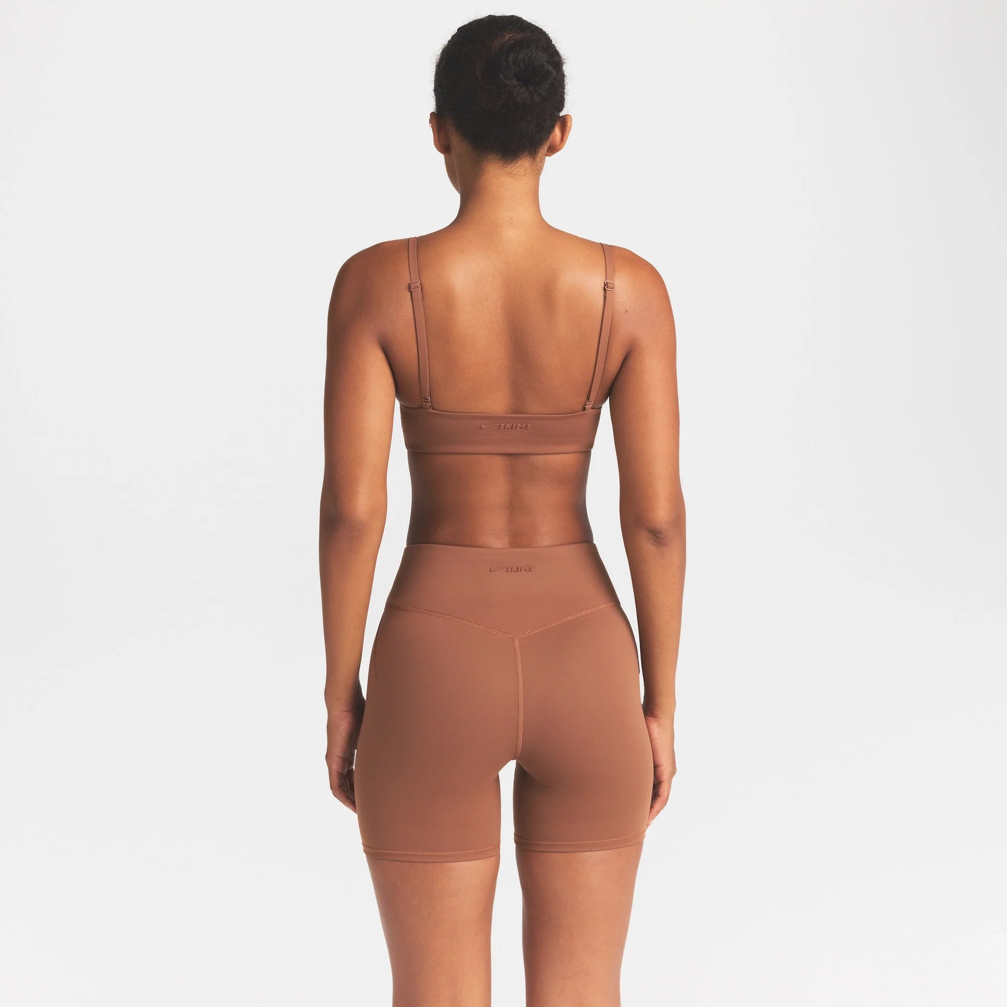 NikeSKIMS MATTE MICRO SCOOP BRA | CAROB BROWN ON A MODEL SIDE VIEW @ | FOCUS: 0.0, 1.0, 0.9