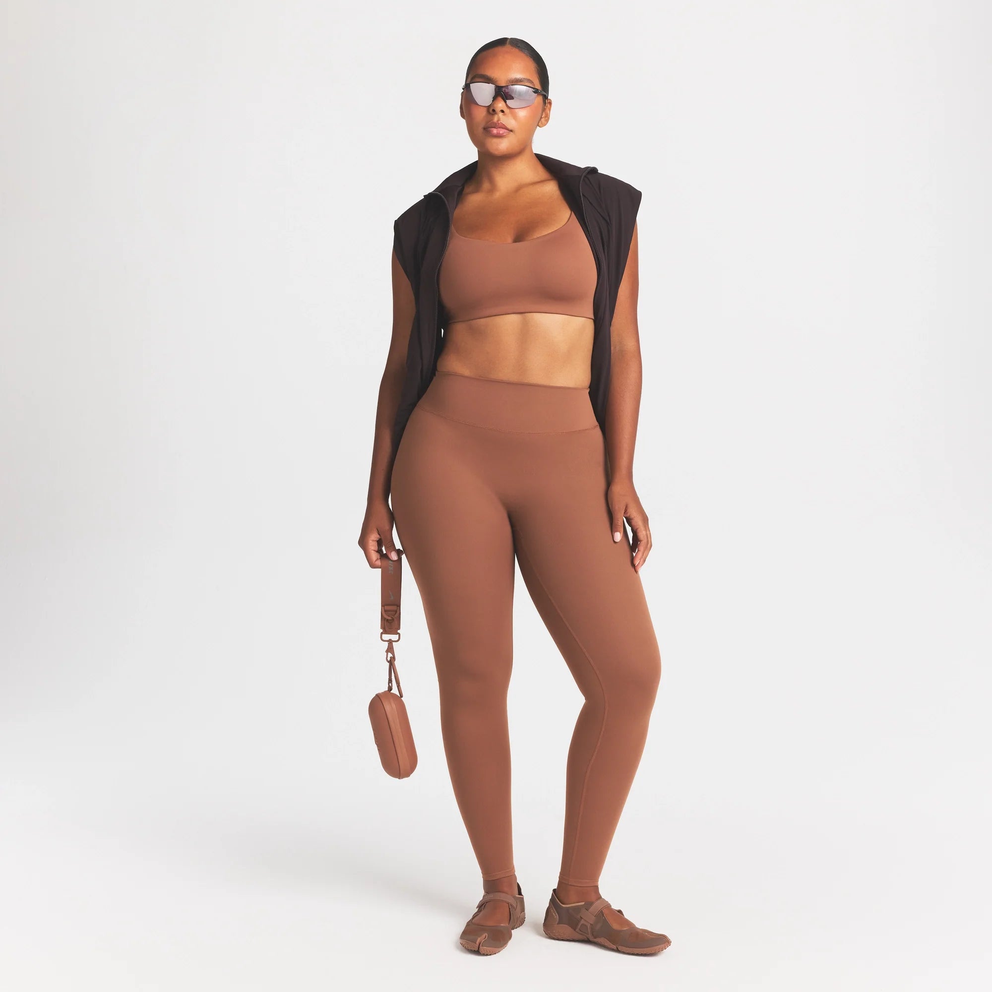 NikeSKIMS MATTE SCOOP NECK BRA | CAROB BROWN ON A MODEL FRONT VIEW @ | FOCUS: 0.0, 1.0, 0.9