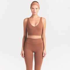 NikeSKIMS MATTE V-NECK BRA TOP | CAROB BROWN ON A MODEL SIDE VIEW @ | FOCUS: 0.0, 1.0, 0.9