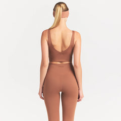 NikeSKIMS MATTE V-NECK BRA TOP | CAROB BROWN ON A MODEL SIDE VIEW @ | FOCUS: 0.0, 1.0, 0.9