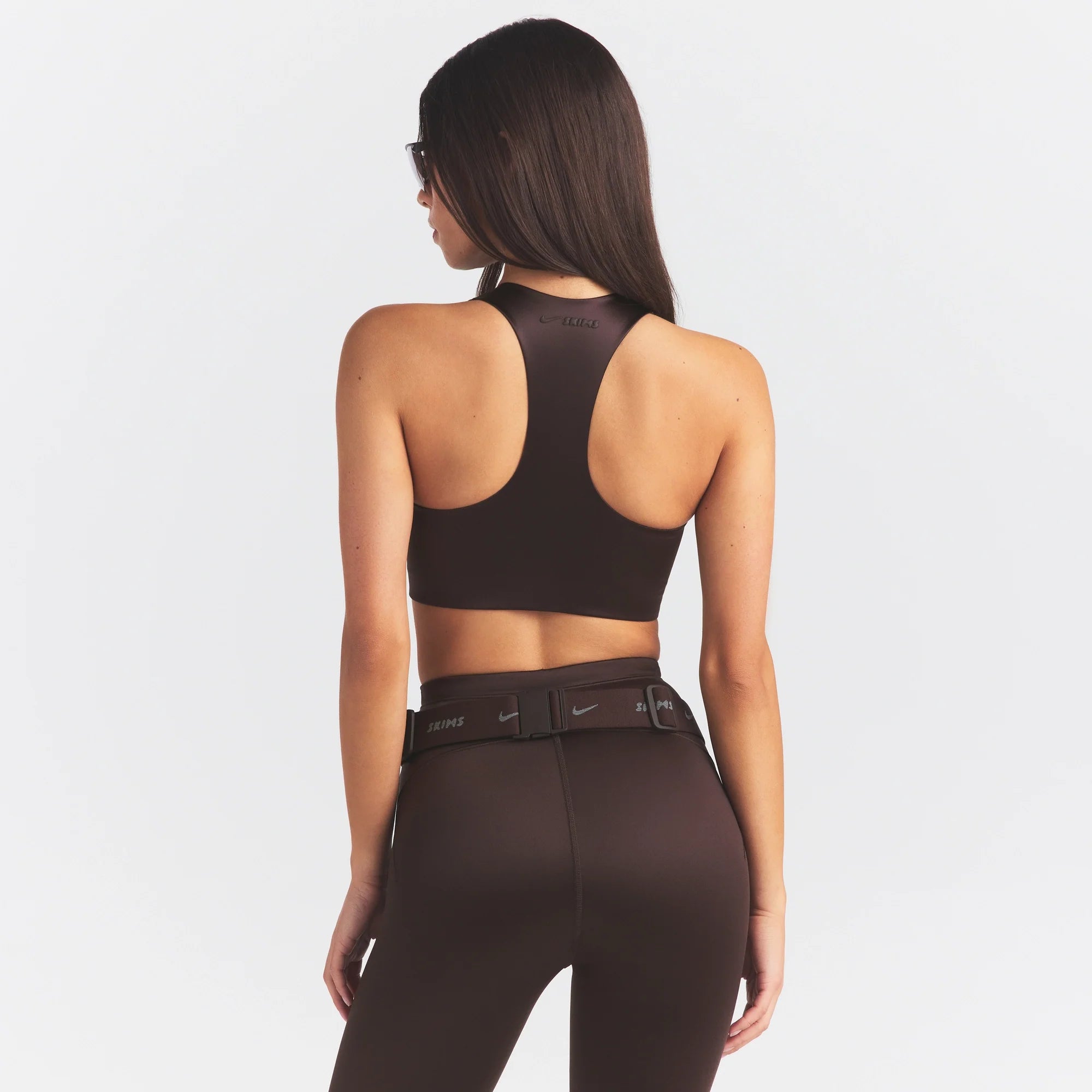 NikeSKIMS SATIN SHINE RACER BACK ZIP FRONT BRA | PHOENIX ON A MODEL SIDE VIEW @ | FOCUS: 0.0, 1.0, 0.9