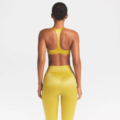 NikeSKIMS SATIN SHINE PLUNGE T-BACK BRA | CITRINE ON A MODEL SIDE VIEW @ | FOCUS: 0.0, 1.0, 0.9