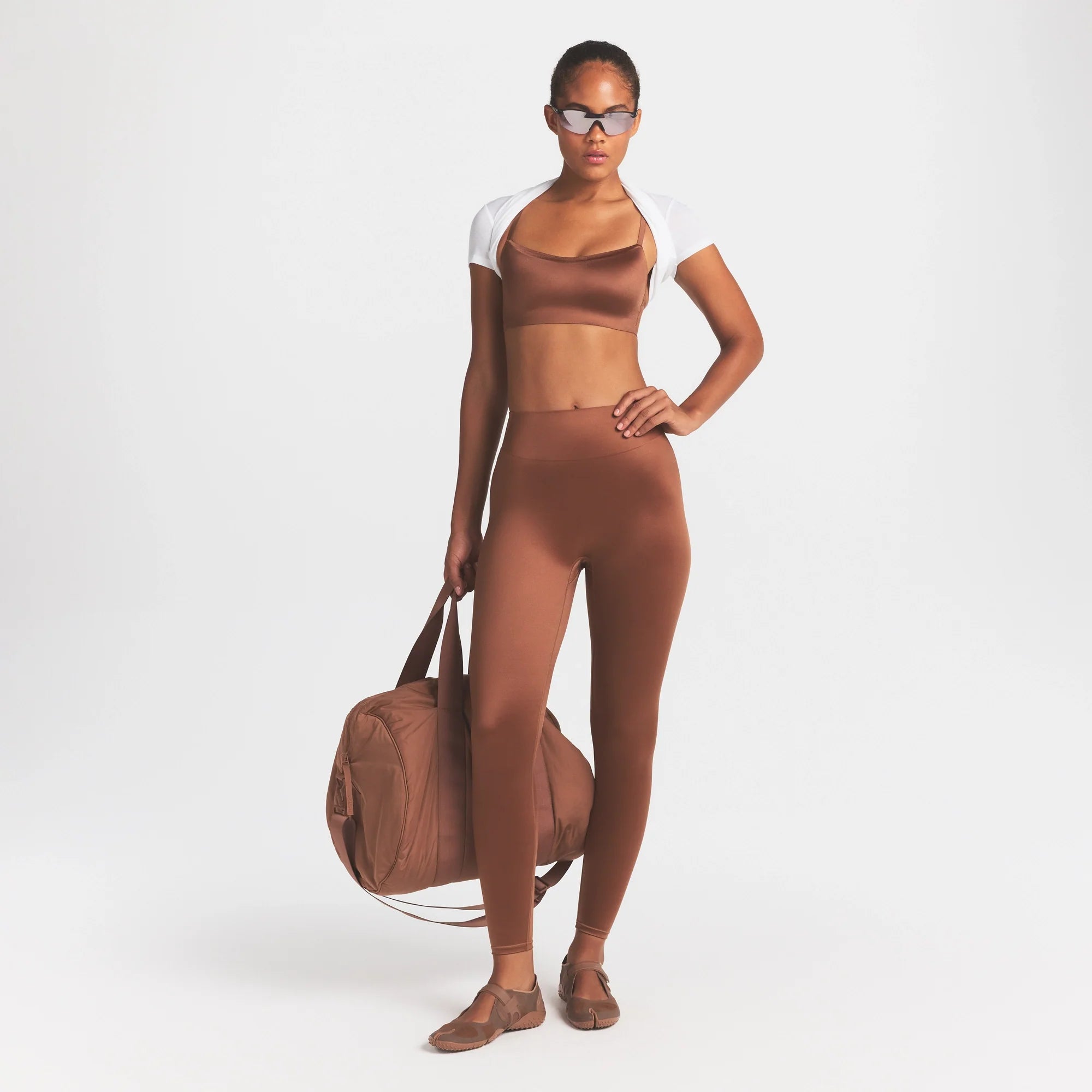 NikeSKIMS SATIN SHINE SCOOP CAMI BRA | CAROB BROWN ON A MODEL FRONT VIEW @ | FOCUS: 0.0, 1.0, 0.9