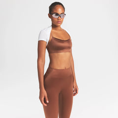 NikeSKIMS SATIN SHINE SCOOP CAMI BRA | CAROB BROWN ON A MODEL SIDE VIEW @ | FOCUS: 0.0, 1.0, 0.9