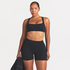 NikeSKIMS STUDIO STRETCH RACERBACK BRA | OBSIDIAN ON A MODEL SIDE VIEW @ | FOCUS: 0.0, 1.0, 0.9