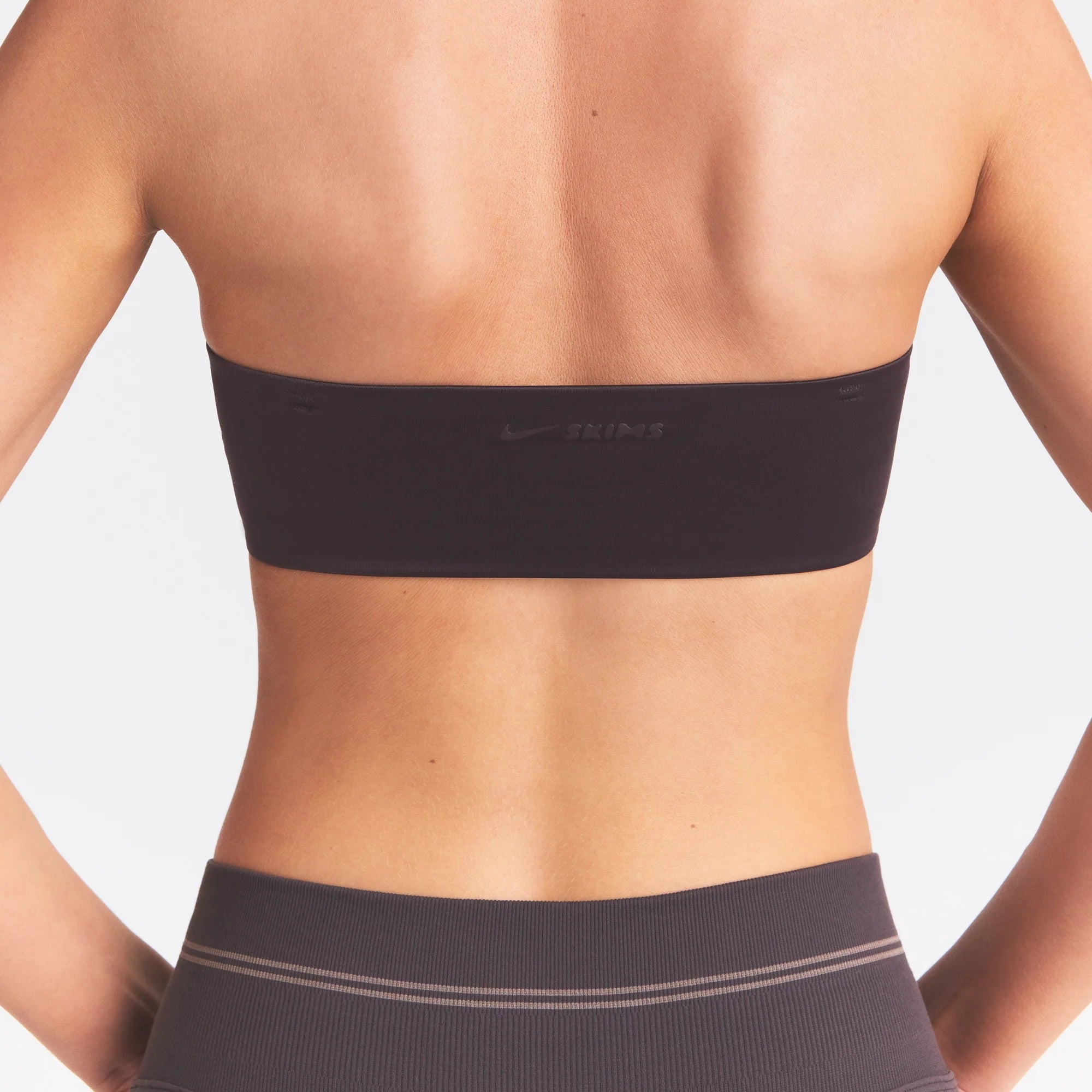 NikeSKIMS SATIN SHINE BANDEAU BRA | PHOENIX ON A MODEL SIDE VIEW @ | FOCUS: 0.0, 1.0, 0.9