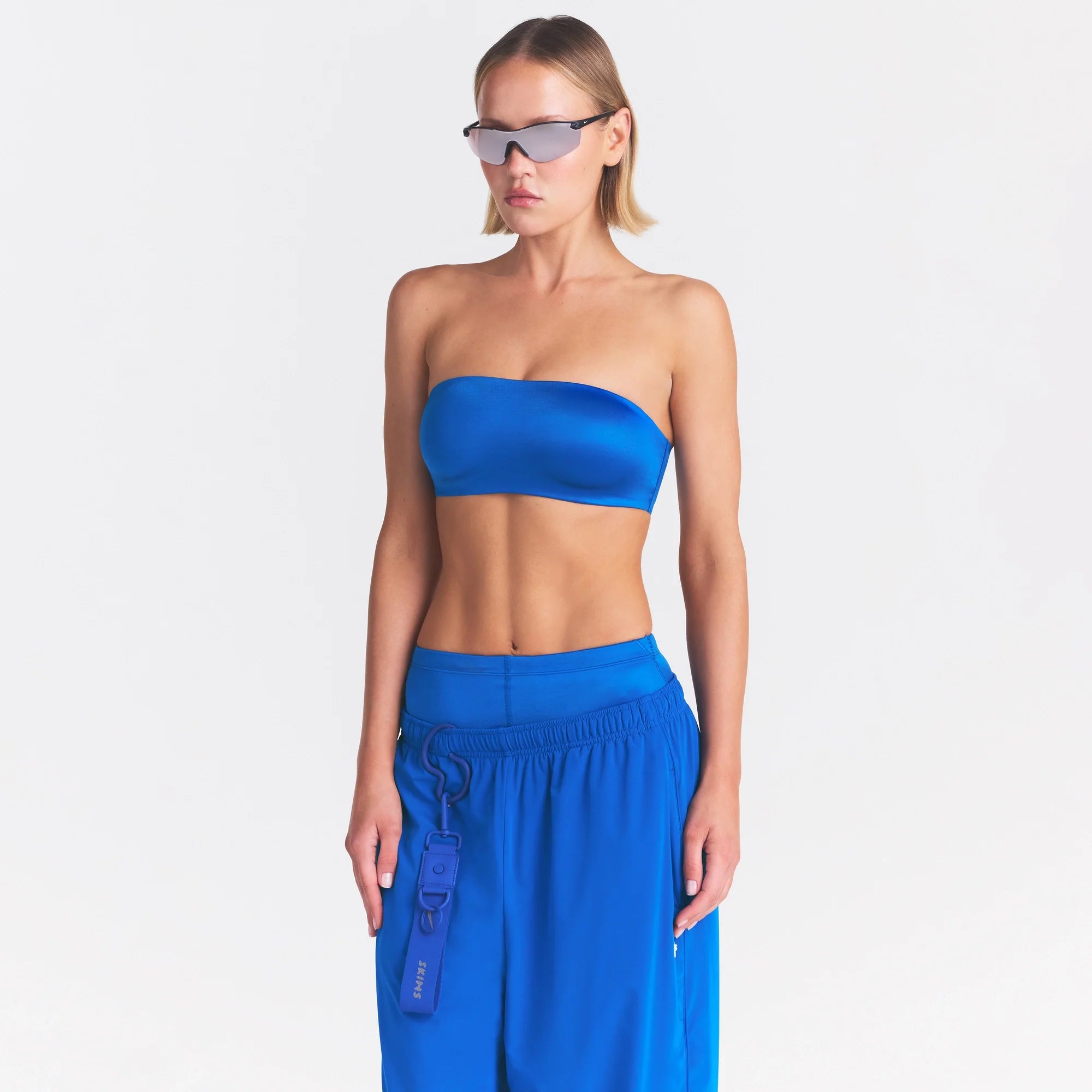 NikeSKIMS SATIN SHINE BANDEAU BRA | COBALT ON A MODEL SIDE VIEW @ | FOCUS: 0.0, 1.0, 0.9