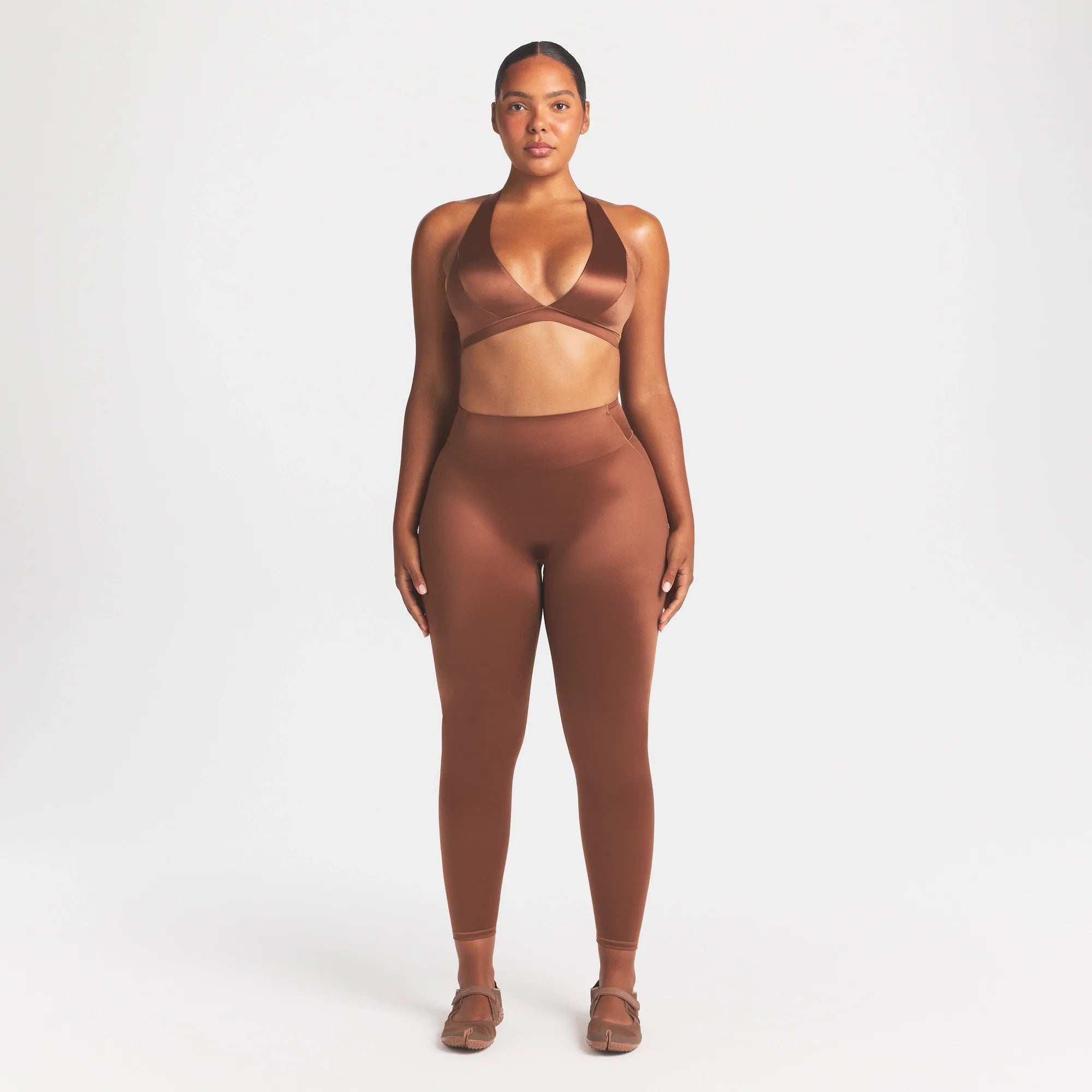NikeSKIMS SATIN SHINE RACERBACK BRA | CAROB BROWN ON A MODEL FRONT VIEW @ | FOCUS: 0.0, 1.0, 0.9