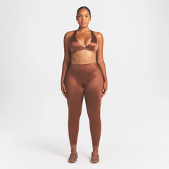NikeSKIMS SATIN SHINE RACERBACK BRA | CAROB BROWN ON A MODEL FRONT VIEW @ | FOCUS: 0.0, 1.0, 0.9