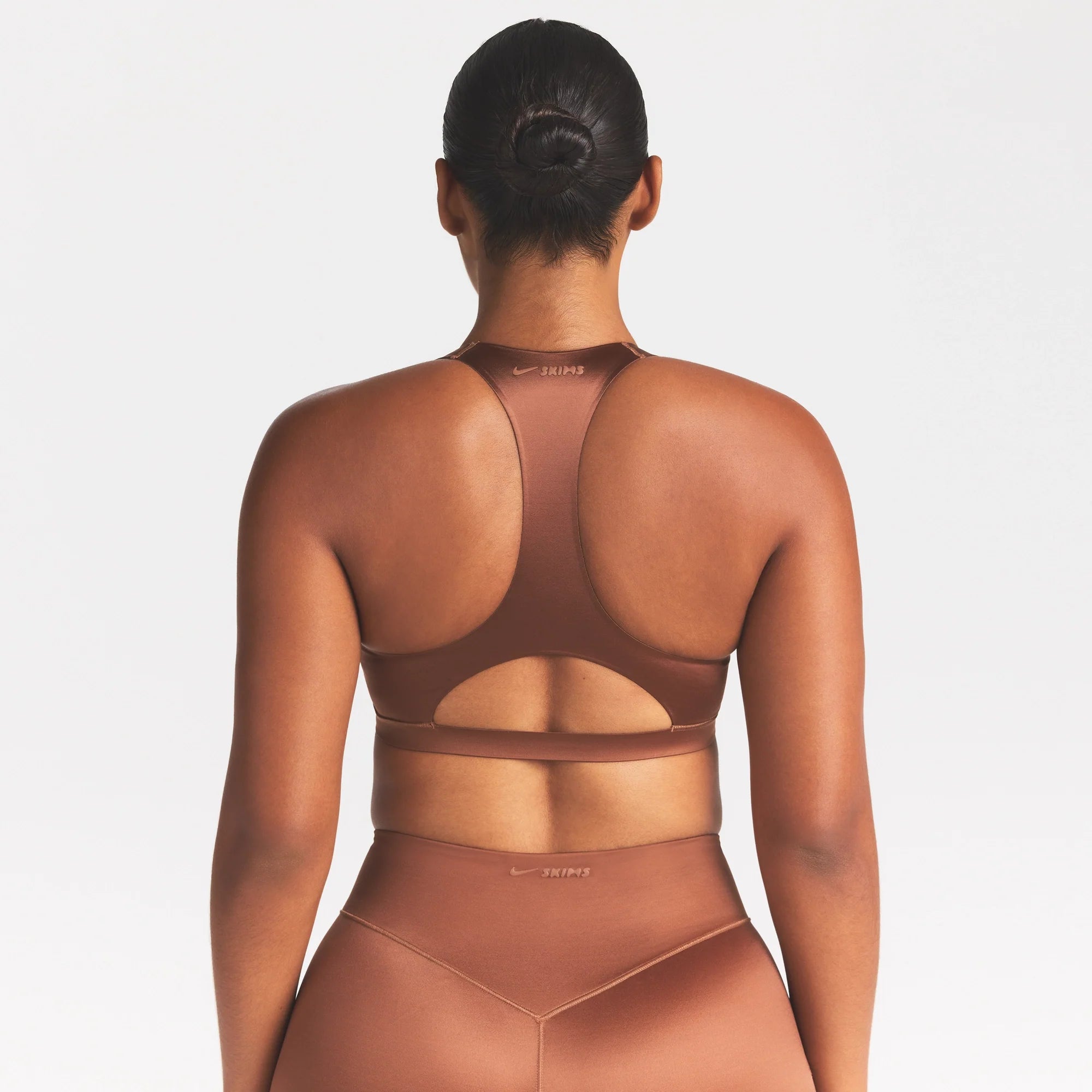 NikeSKIMS SATIN SHINE RACERBACK BRA | CAROB BROWN ON A MODEL SIDE VIEW @ | FOCUS: 0.0, 1.0, 0.9