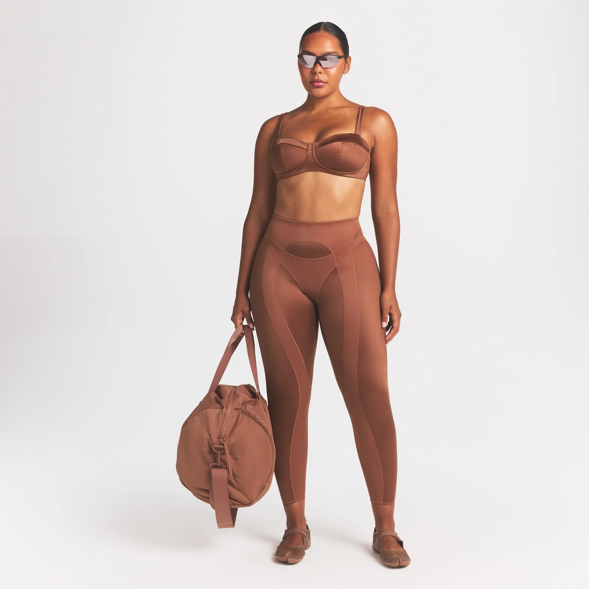 NikeSKIMS SATIN SHINE PANELED PICOT BRA | CAROB BROWN ON A MODEL FRONT VIEW @ | FOCUS: 0.0, 1.0, 0.9