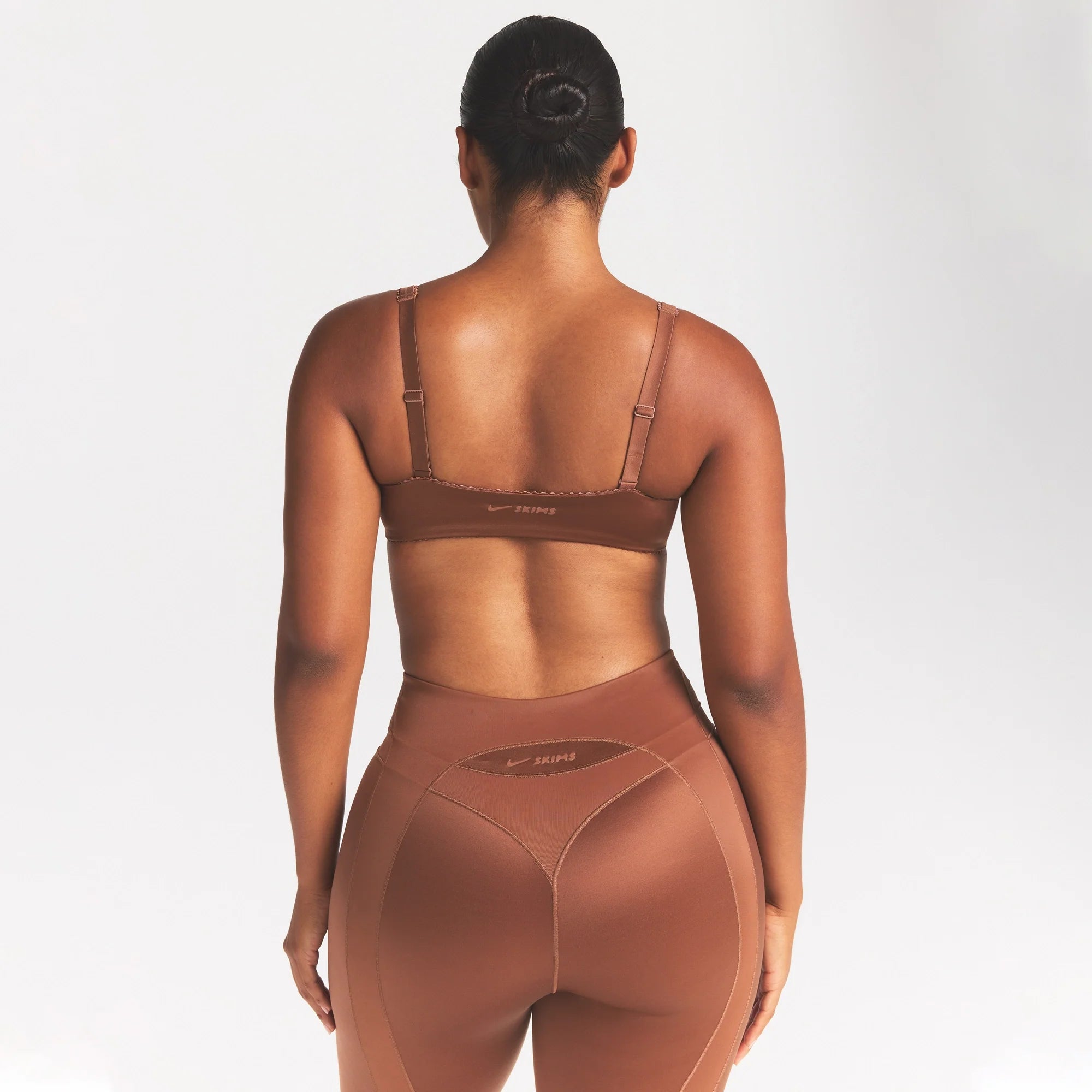 NikeSKIMS SATIN SHINE PANELED PICOT BRA | CAROB BROWN ON A MODEL SIDE VIEW @ | FOCUS: 0.0, 1.0, 0.9