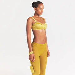 NikeSKIMS SATIN SHINE PANELED PICOT BRA | CITRINE ON A MODEL SIDE VIEW @ | FOCUS: 0.0, 1.0, 0.9