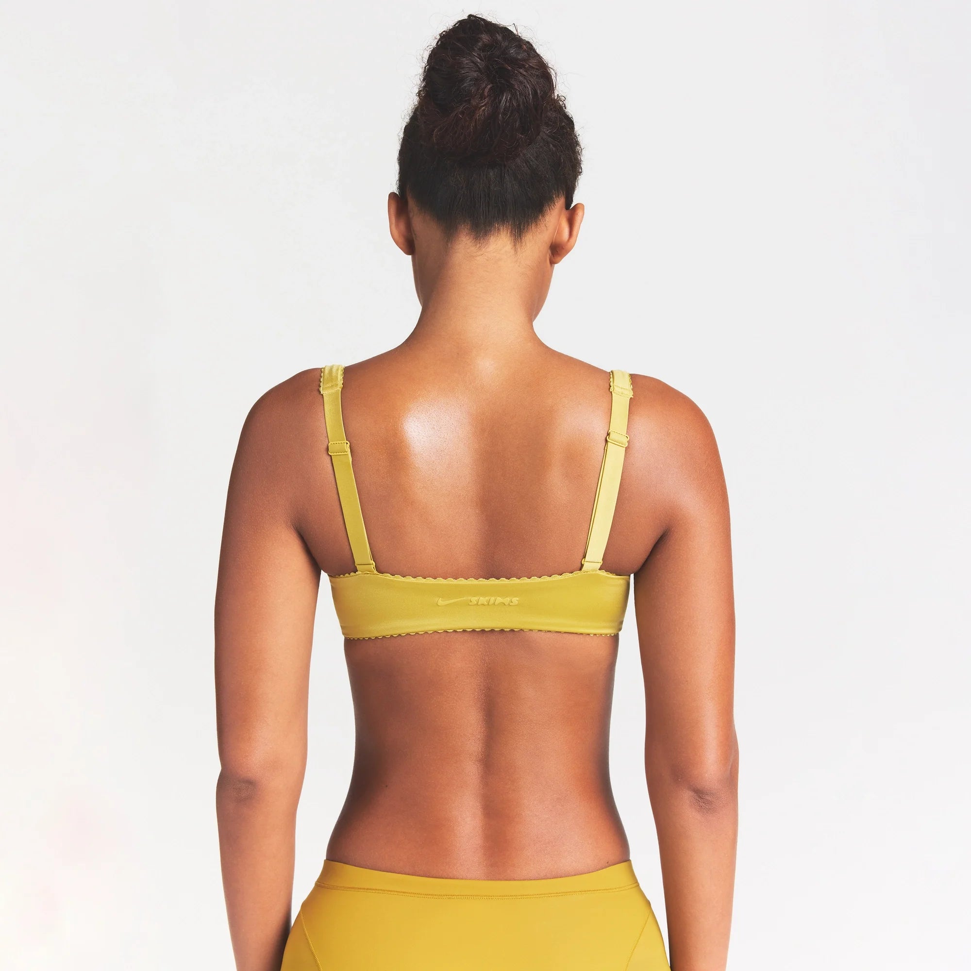 NikeSKIMS SATIN SHINE PANELED PICOT BRA | CITRINE ON A MODEL SIDE VIEW @ | FOCUS: 0.0, 1.0, 0.9