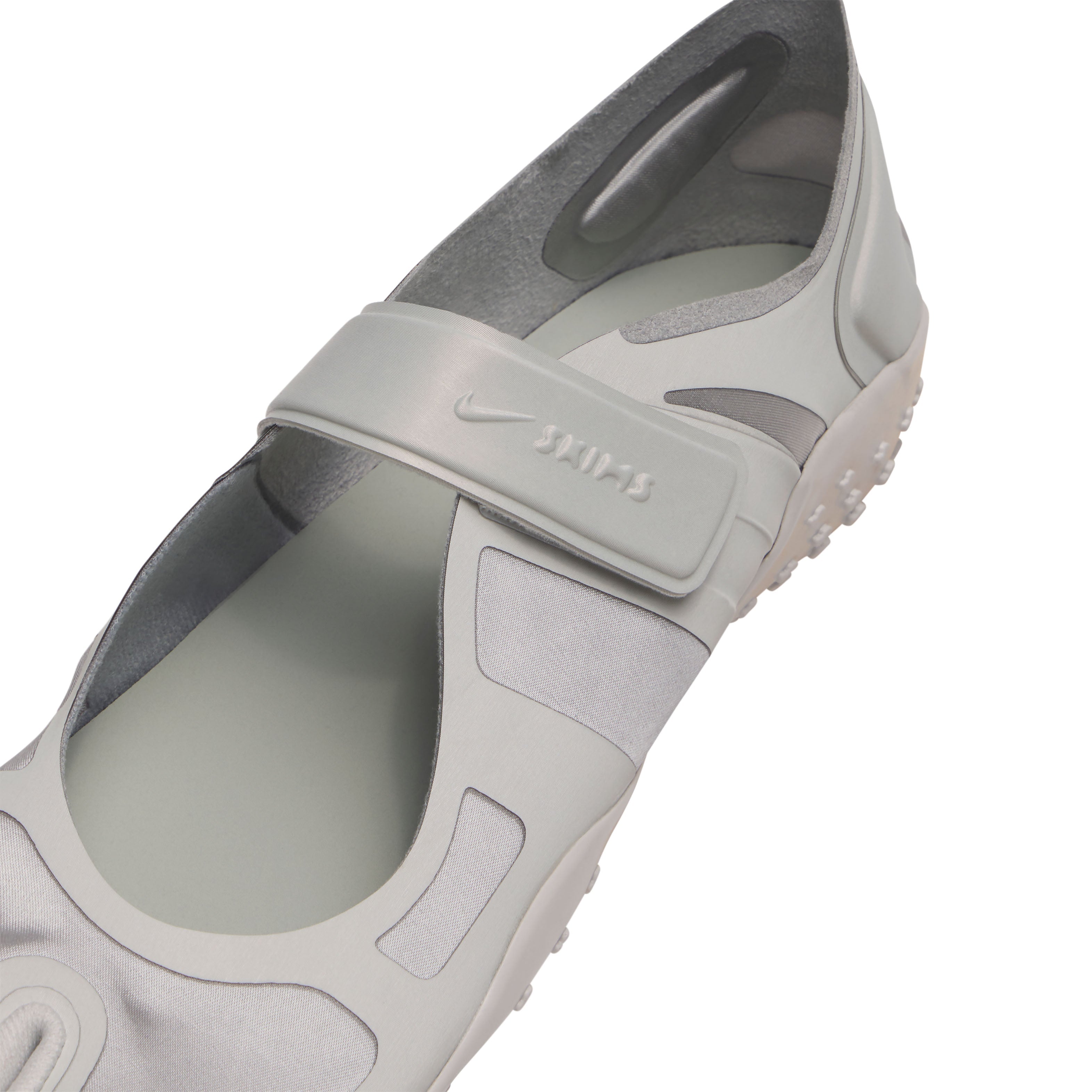 NikeSKIMS FOOTWEAR RIFT SATIN | LT BONE FLAT ON A WHITE BACKGROUND | FLT
