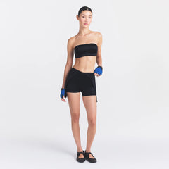 NikeSKIMS SATIN SHINE SUSPENDER 2.5" ONESIE | OBSIDIAN ON A MODEL FRONT VIEW