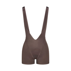 NikeSKIMS SHINE SUSPENDER 2.5 INCH ONESIE | NSKM RESIN FLAT ON A WHITE BACKGROUND | FLT