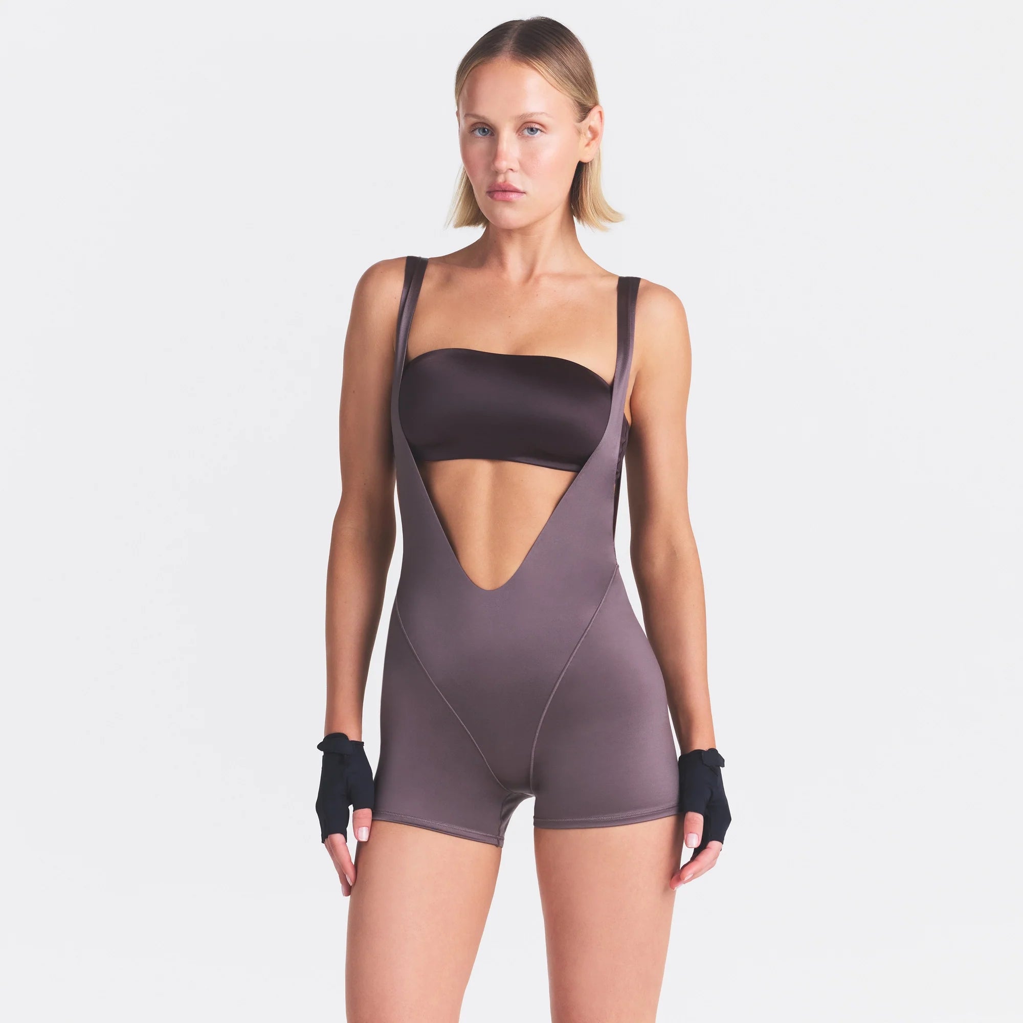 NikeSKIMS SATIN SHINE SUSPENDER 2.5" ONESIE | RESIN ON A MODEL SIDE VIEW