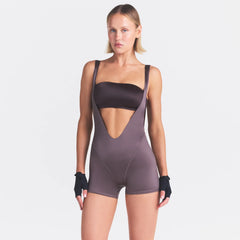 NikeSKIMS SATIN SHINE SUSPENDER 2.5" ONESIE | RESIN ON A MODEL SIDE VIEW