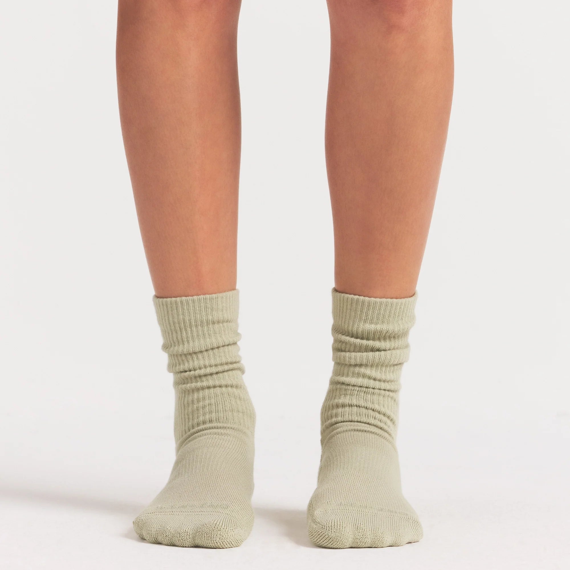 NikeSKIMS ACCESSORIES DRI-FIT™ CREW SOCK 3-PACK | DRIFTWOOD/TALC/BICYCLE YELLOW ON A MODEL SIDE VIEW