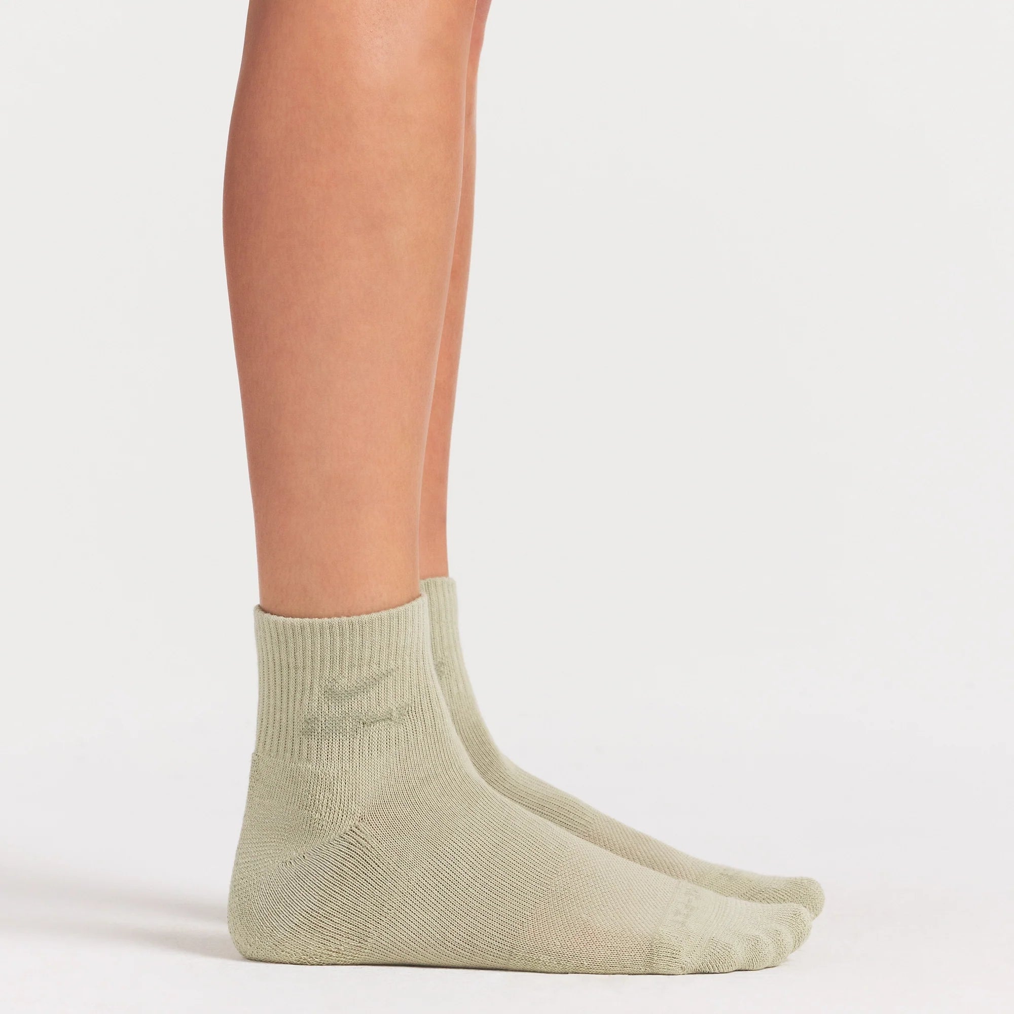 NikeSKIMS ACCESSORIES DRI-FIT™ QUARTER CREW SOCK 3-PACK | DRIFTWOOD/TALC/BICYCLE YELLOW ON A MODEL SIDE VIEW @ | FOCUS: 0.0, 1.0, 0.9