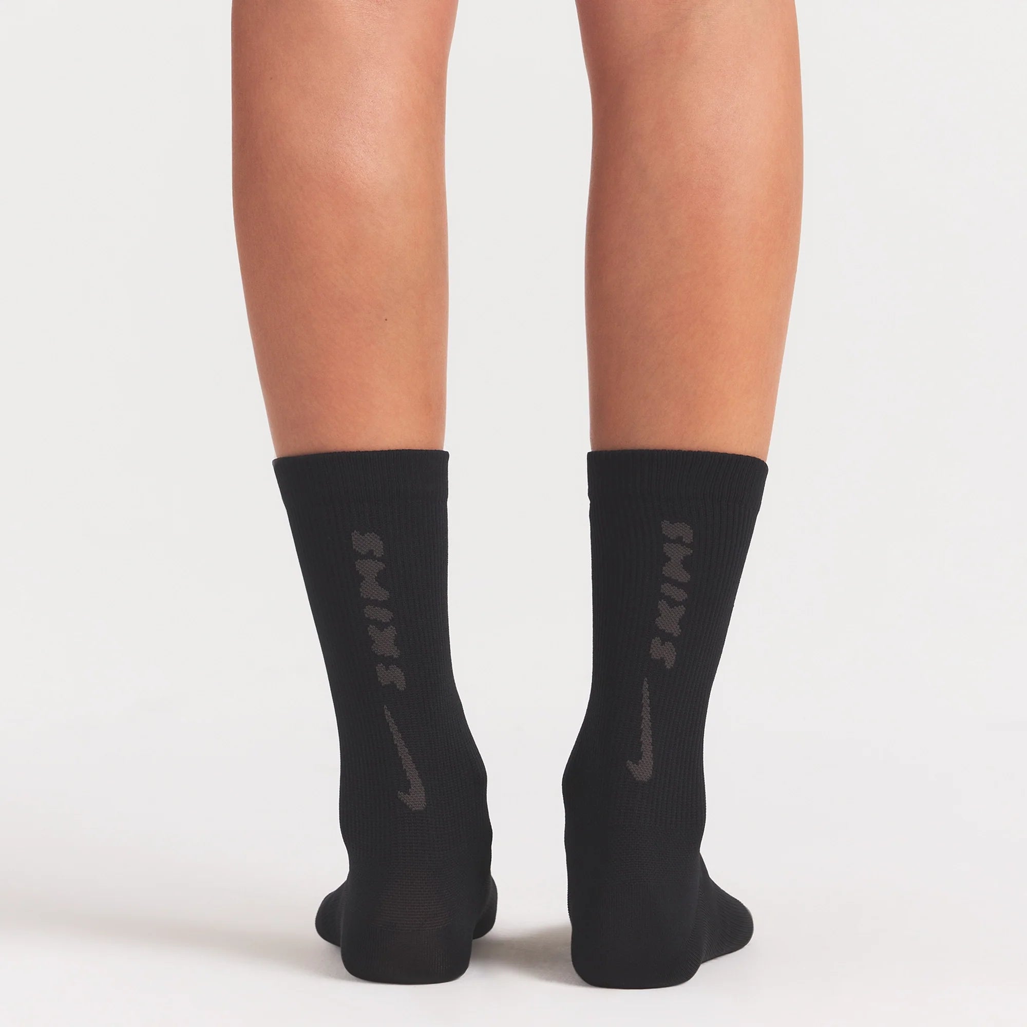 NikeSKIMS ACCESSORIES RIFT CREW SOCK | OBSIDIAN/(BOULDER) ON A MODEL SIDE VIEW @ | FOCUS: 0.0, 1.0, 0.9
