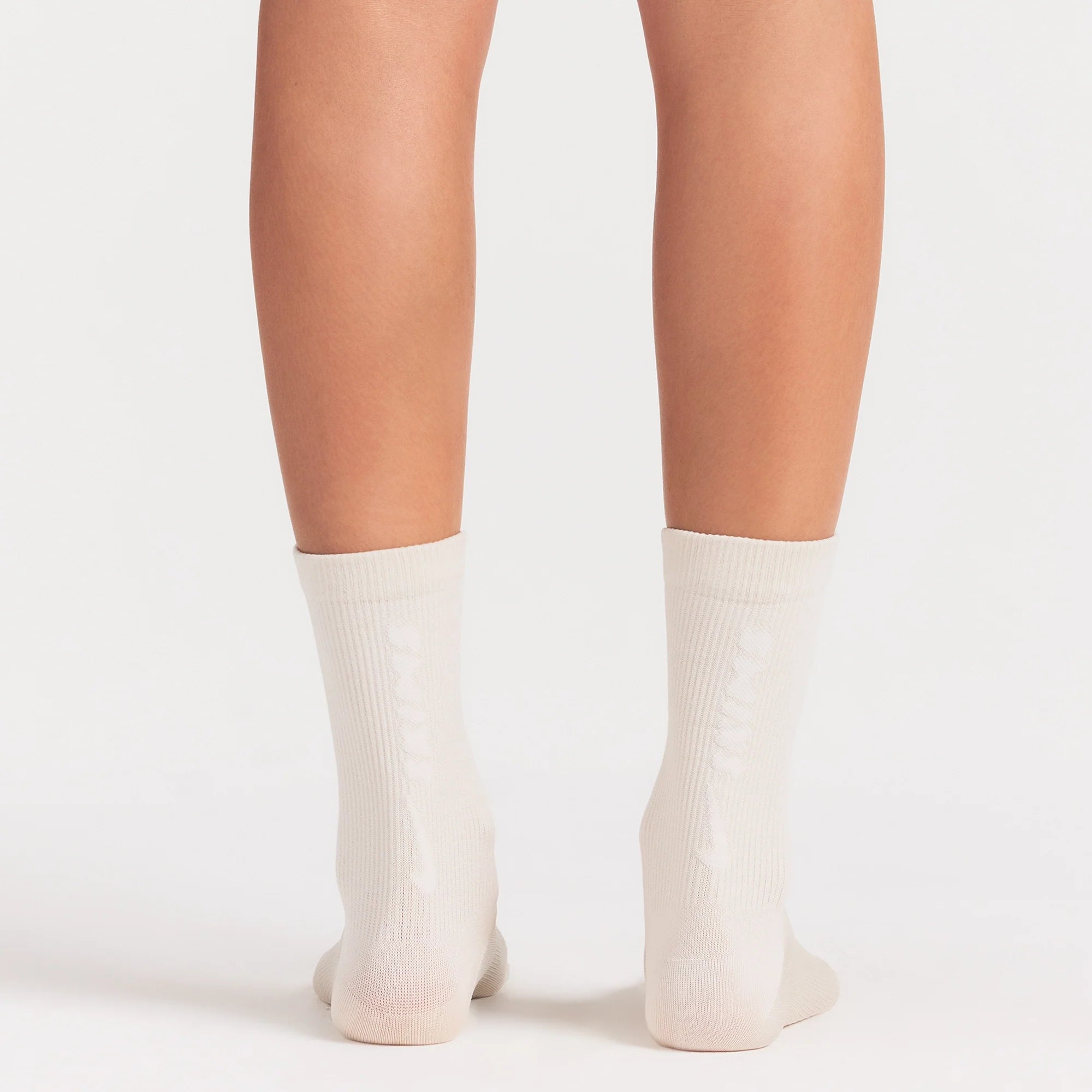 NikeSKIMS ACCESSORIES RIFT CREW SOCK | LIGHT OREWOOD BROWN ON A MODEL SIDE VIEW @ | FOCUS: 0.0, 1.0, 0.9