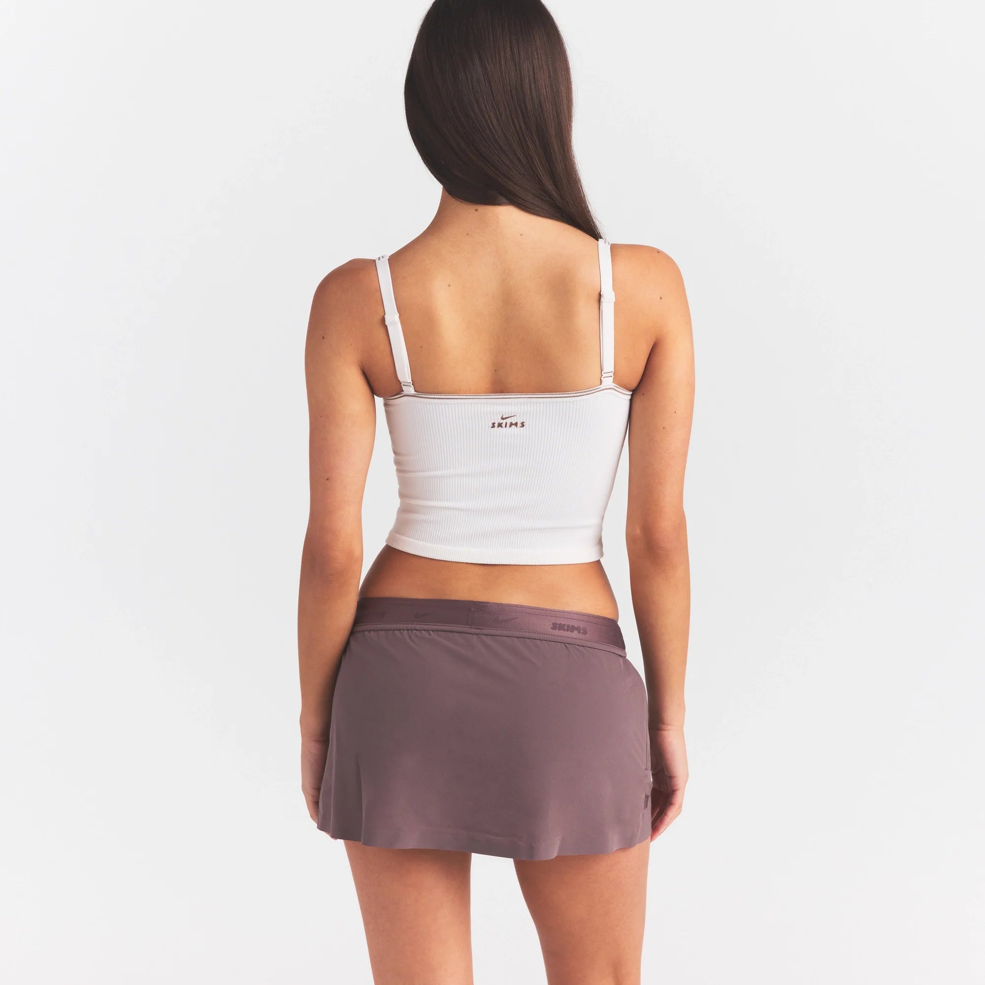 NikeSKIMS RIBBED SEAMLESS CAMI TANK | IVORY ON A MODEL SIDE VIEW @ | FOCUS: 0.0, 1.0, 0.9