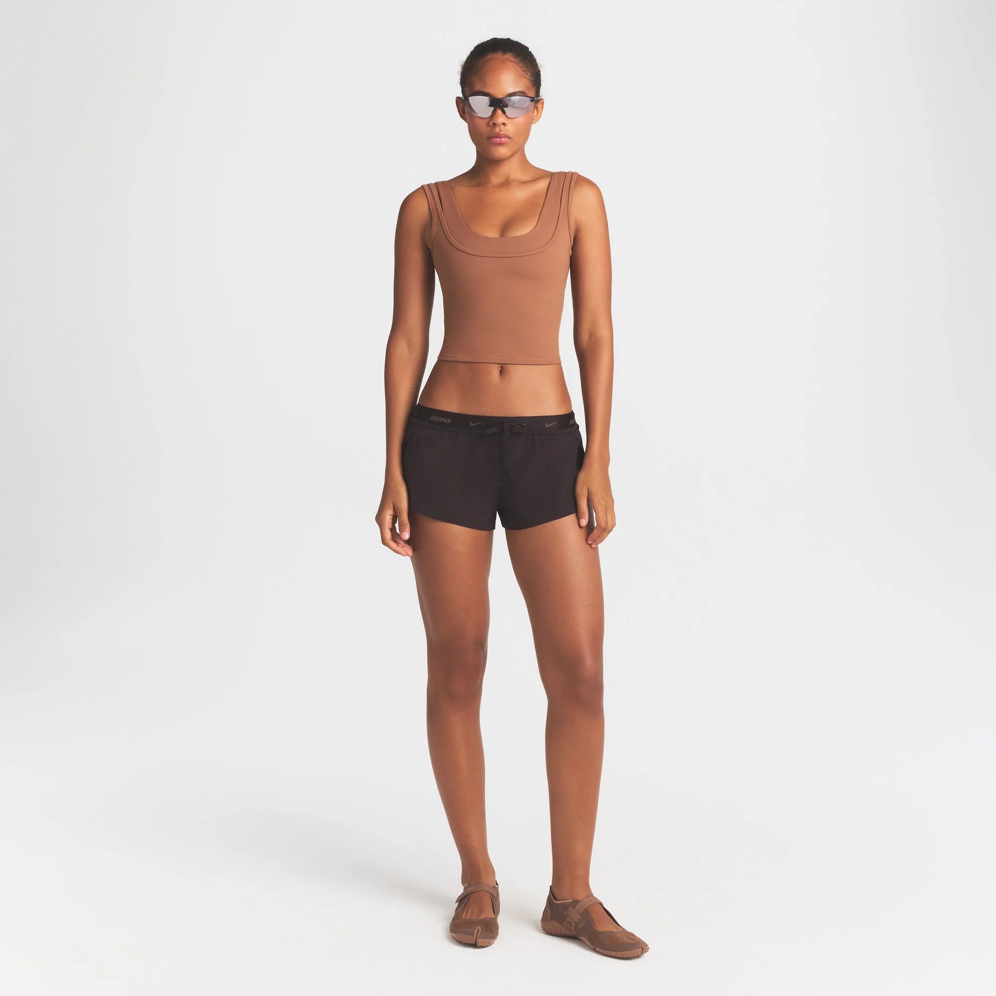 NikeSKIMS MATTE DOUBLE STRAP SCOOP TANK | CAROB BROWN ON A MODEL FRONT VIEW @ | FOCUS: 0.0, 1.0, 0.9