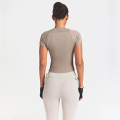 NikeSKIMS AIRY DRI-FIT BABY T-SHIRT | DRIFTWOOD ON A MODEL SIDE VIEW @ | FOCUS: 0.0, 1.0, 0.9