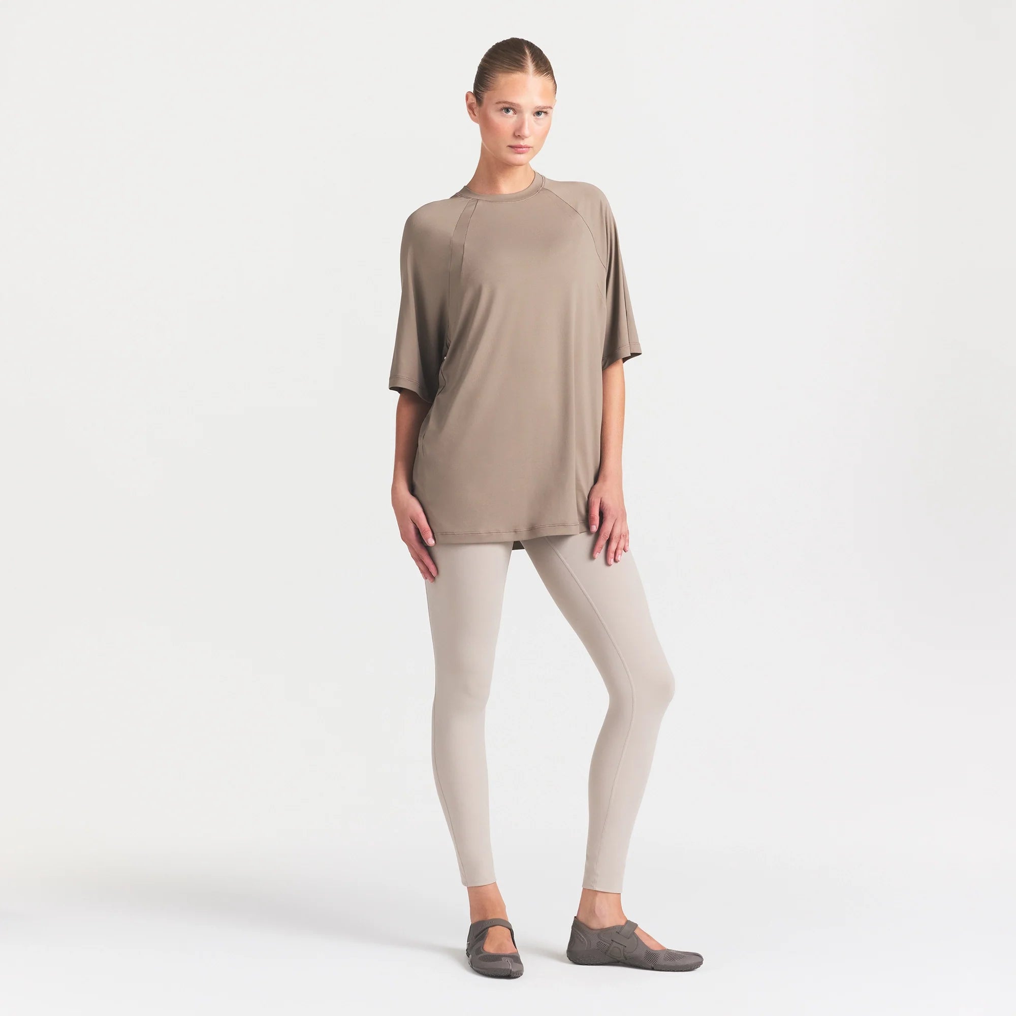 NikeSKIMS AIRY DRI-FIT OVERSIZED T-SHIRT | DRIFTWOOD ON A MODEL FRONT VIEW @ | FOCUS: 0.0, 1.0, 0.9