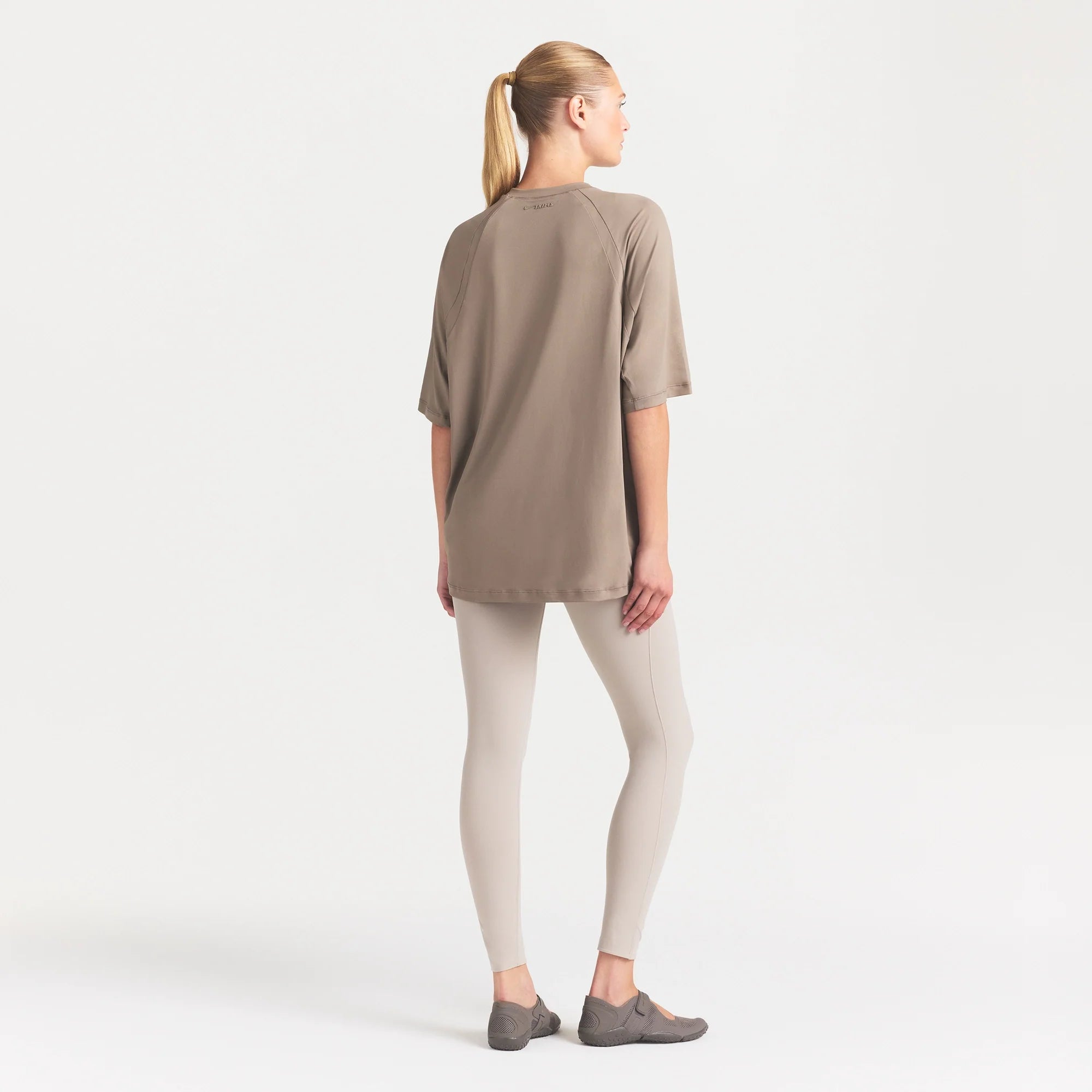 NikeSKIMS AIRY DRI-FIT OVERSIZED T-SHIRT | DRIFTWOOD ON A MODEL FRONT VIEW @ | FOCUS: 0.0, 1.0, 0.9