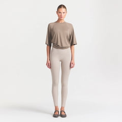 NikeSKIMS AIRY DRI-FIT OVERSIZED T-SHIRT | DRIFTWOOD ON A MODEL FRONT VIEW @ | FOCUS: 0.0, 1.0, 0.9