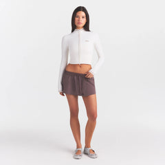 NikeSKIMS RIBBED SEAMLESS ZIP UP CROP JACKE | IVORY ON A MODEL FRONT VIEW @ | FOCUS: 0.0, 1.0, 0.9