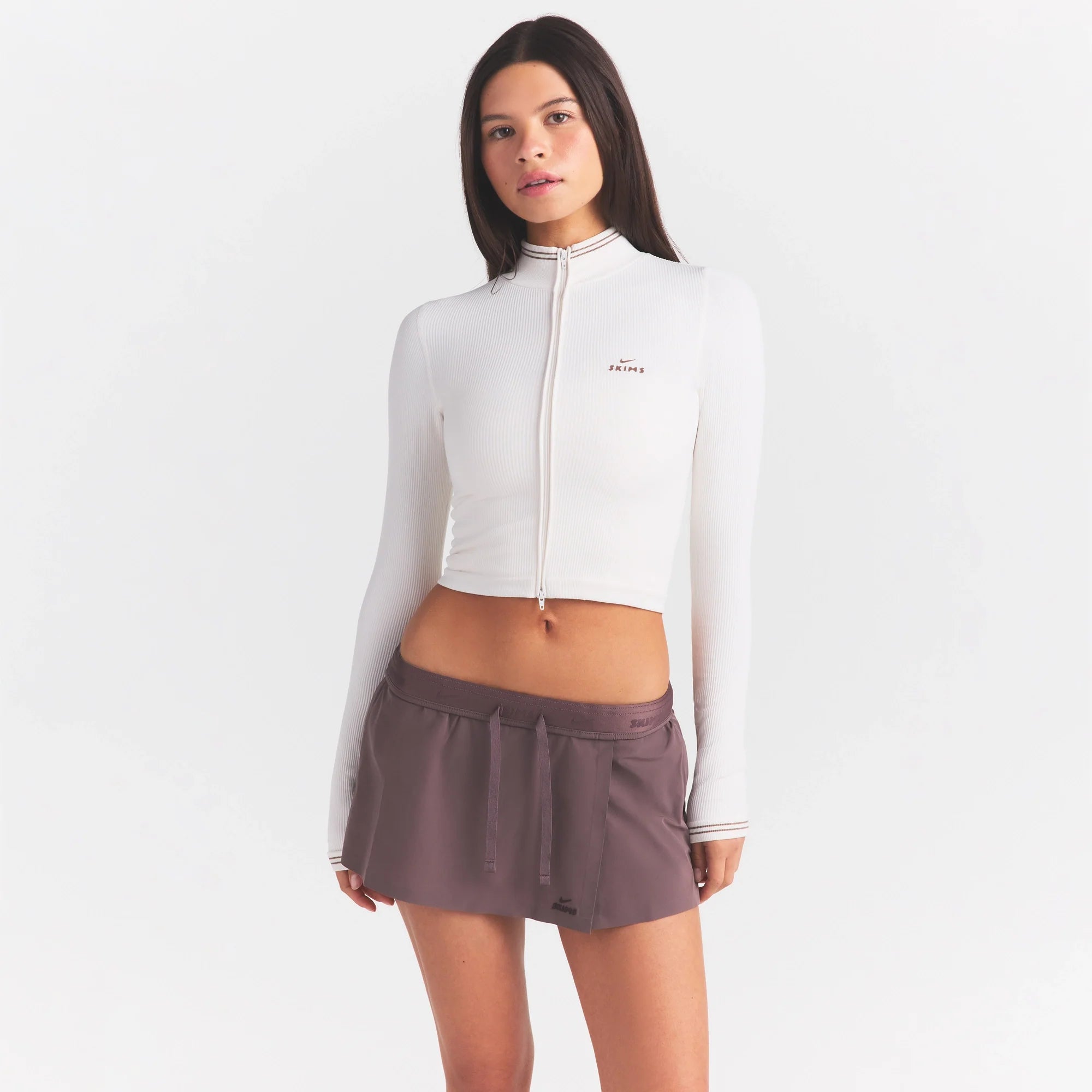 NikeSKIMS RIBBED SEAMLESS ZIP UP CROP JACKE | IVORY ON A MODEL SIDE VIEW @ | FOCUS: 0.0, 1.0, 0.9