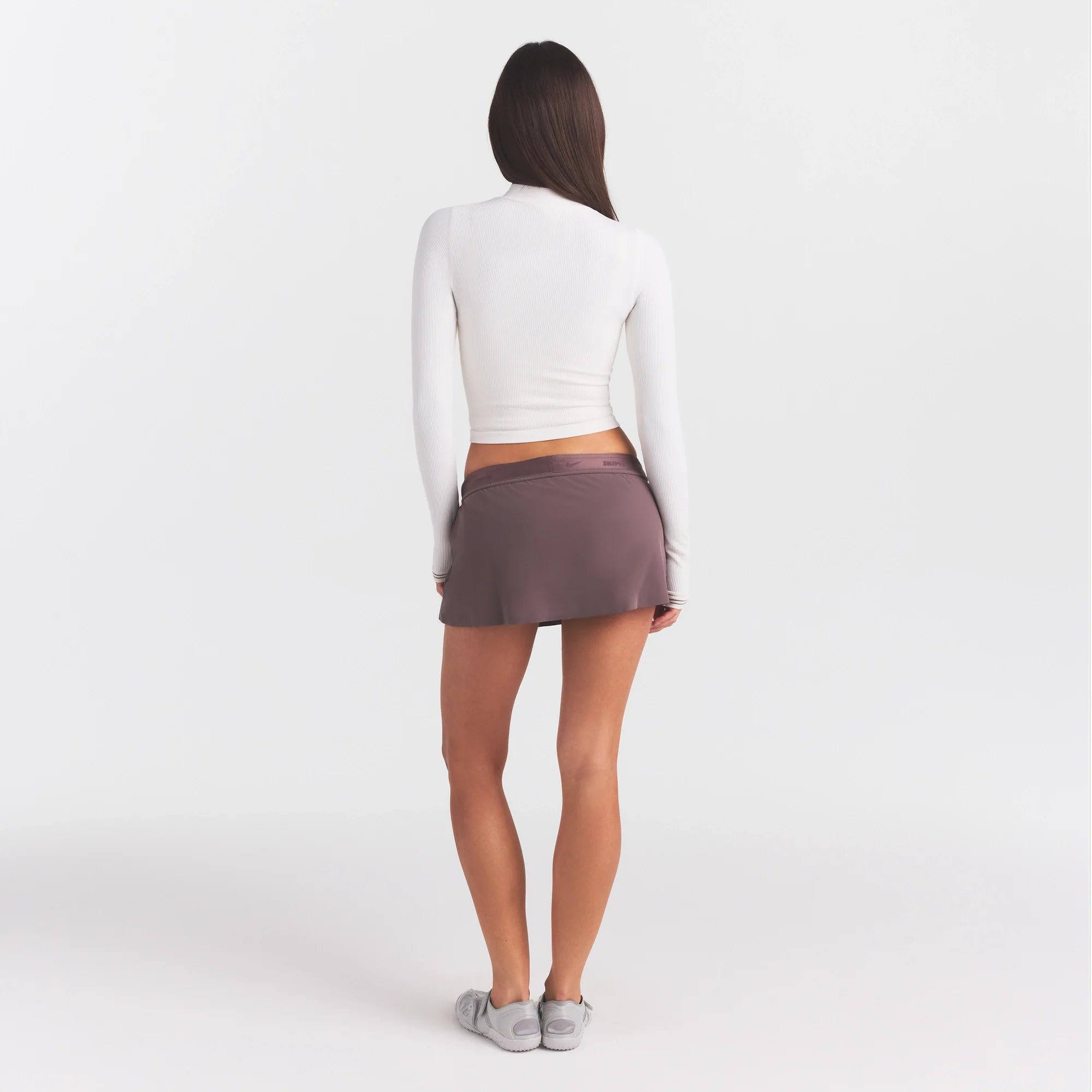 NikeSKIMS RIBBED SEAMLESS ZIP UP CROP JACKE | IVORY ON A MODEL FRONT VIEW @ | FOCUS: 0.0, 1.0, 0.9