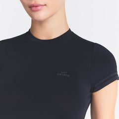 NikeSKIMS STRETCH KNIT CROPPED T-SHIRT | OBSIDIAN ON A MODEL SIDE VIEW @ | FOCUS: 0.0, 1.0, 0.9