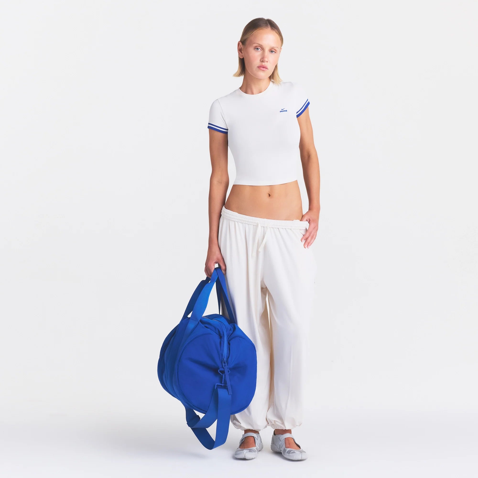 NikeSKIMS STRETCH KNIT CROPPED T-SHIRT | IVORY ON A MODEL FRONT VIEW @ | FOCUS: 0.0, 1.0, 0.9