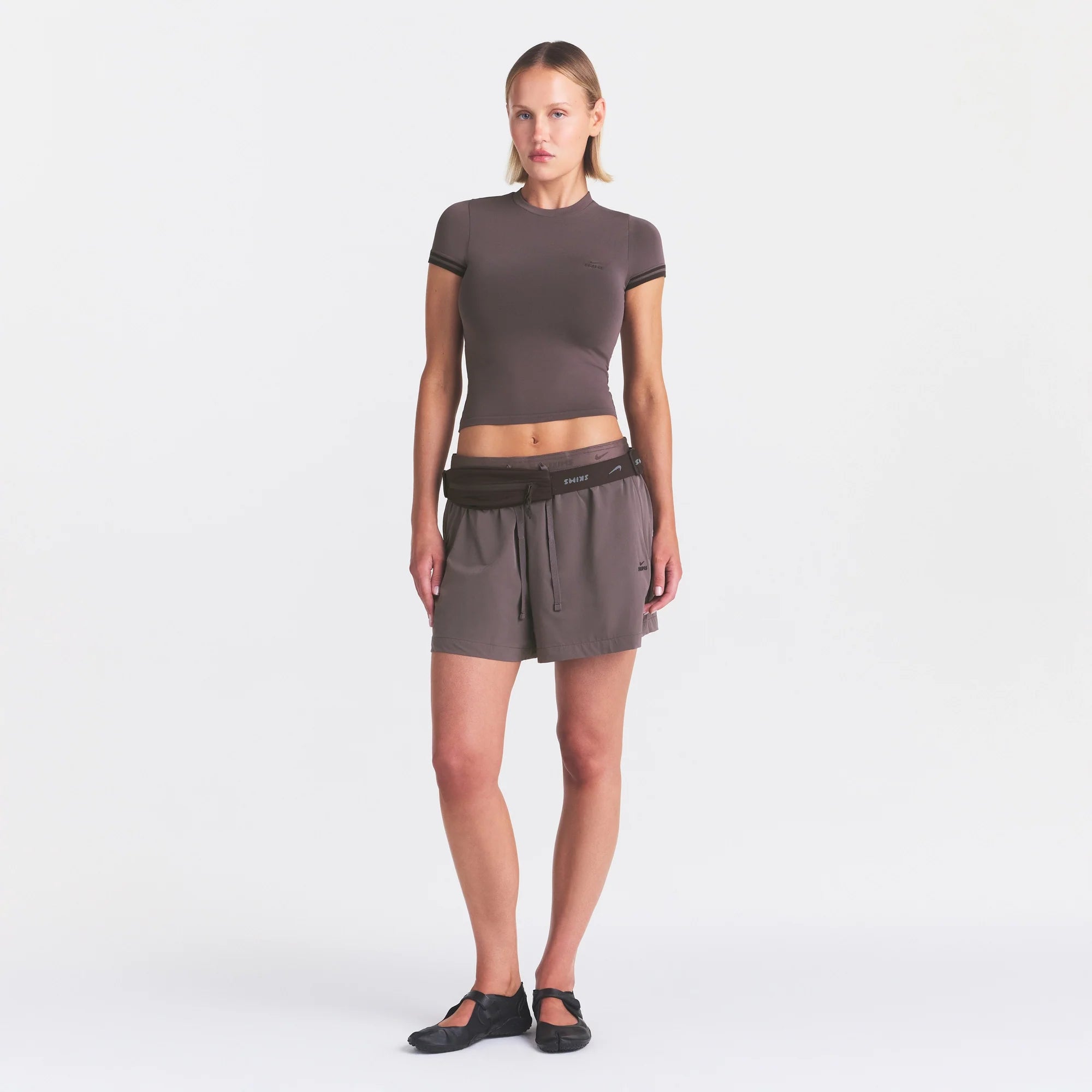 NikeSKIMS STRETCH KNIT CROPPED T-SHIRT | RESIN ON A MODEL FRONT VIEW @ | FOCUS: 0.0, 1.0, 0.9