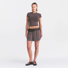 NikeSKIMS STRETCH KNIT CROPPED T-SHIRT | RESIN ON A MODEL FRONT VIEW @ | FOCUS: 0.0, 1.0, 0.9