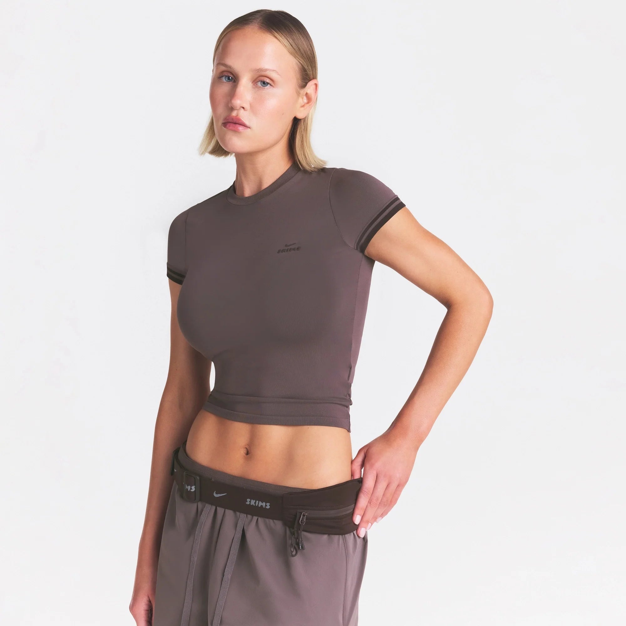 NikeSKIMS STRETCH KNIT CROPPED T-SHIRT | RESIN ON A MODEL SIDE VIEW @ | FOCUS: 0.0, 1.0, 0.9