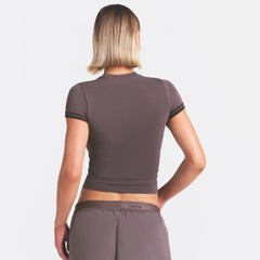 NikeSKIMS STRETCH KNIT CROPPED T-SHIRT | RESIN ON A MODEL SIDE VIEW @ | FOCUS: 0.0, 1.0, 0.9