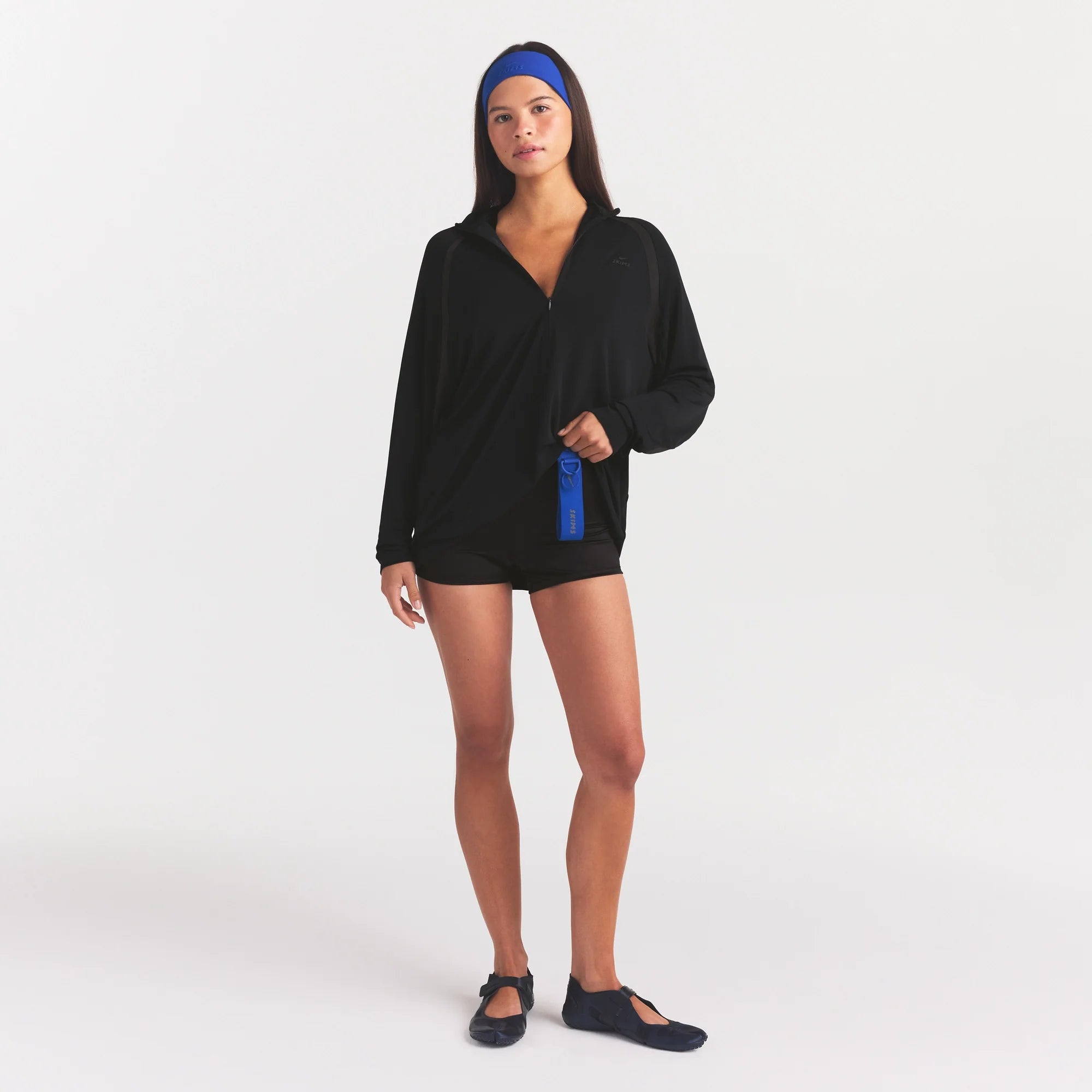 NikeSKIMS STRETCH KNIT LONG SLEEVE HALF ZIP | OBSIDIAN ON A MODEL FRONT VIEW @ | FOCUS: 0.0, 1.0, 0.9