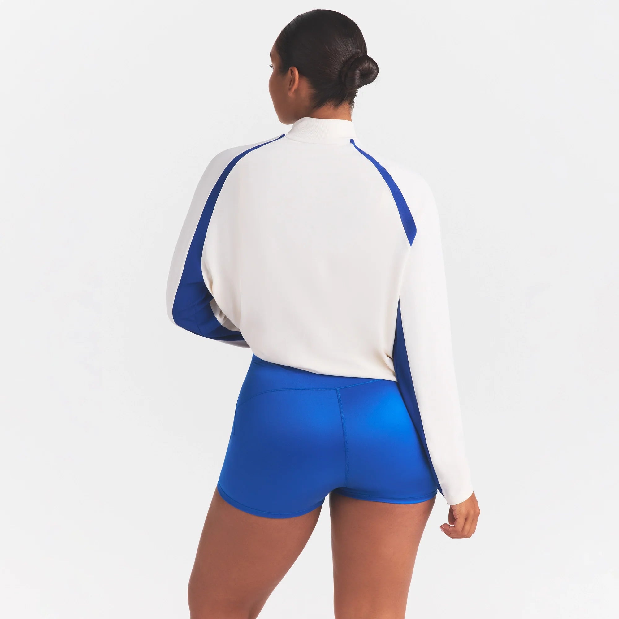 NikeSKIMS STRETCH KNIT LONG SLEEVE HALF ZIP | IVORY ON A MODEL SIDE VIEW @ | FOCUS: 0.0, 1.0, 0.9